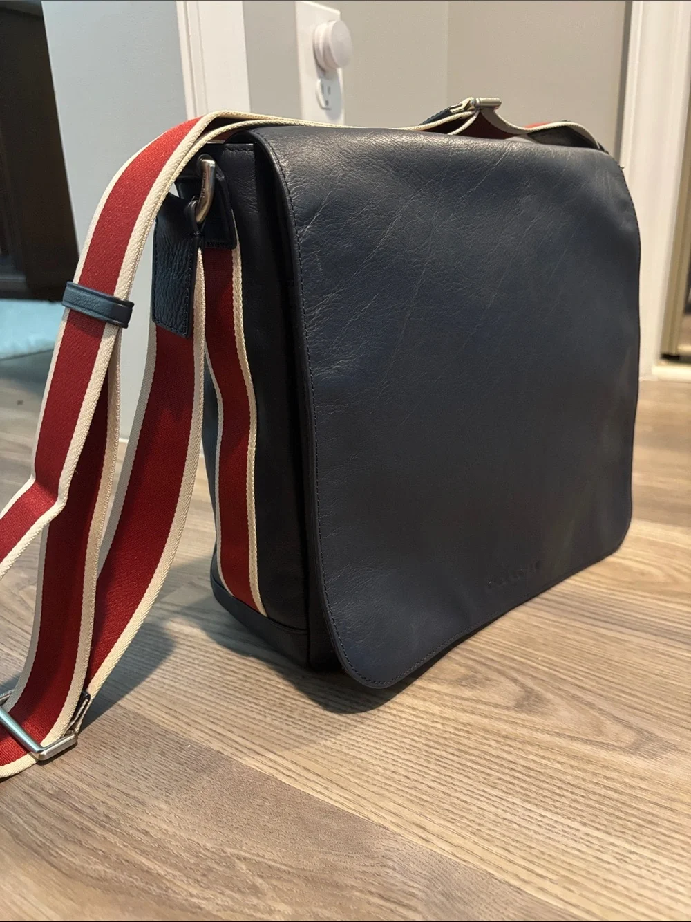 Coach Navy Leather Messenger Bag with Red and White Stripe Strap